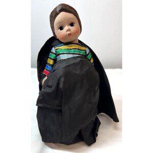 Madame Alexander Collectible Doll With Black Cape & Colorful Striped Dress